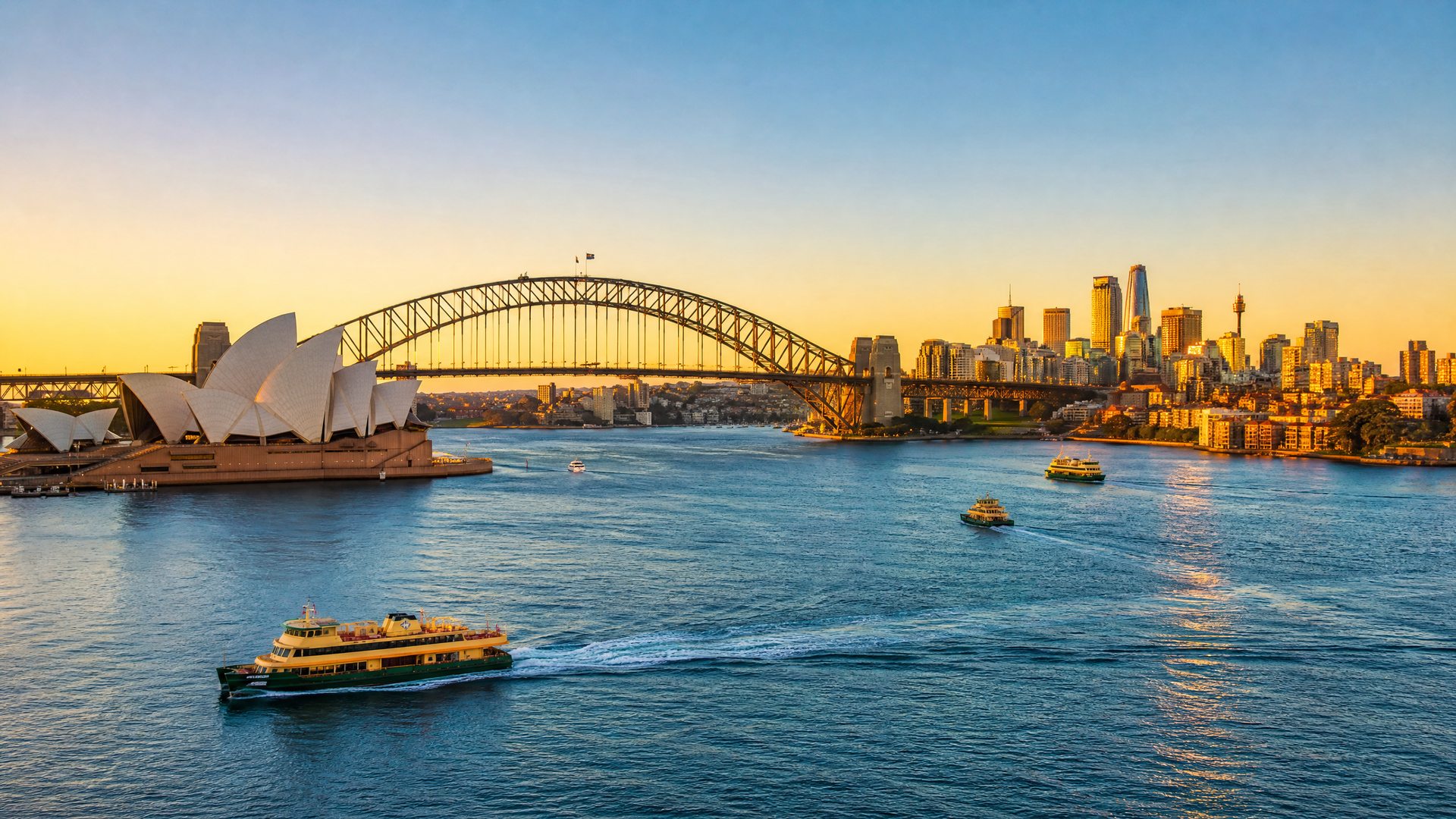 Sydney Harbour with the Opera House and Harbour Bridge at golden hour